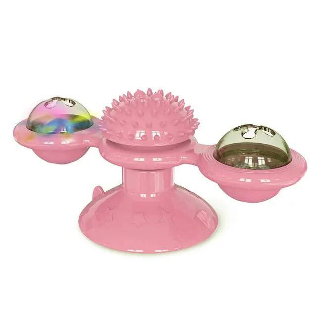 Pink rotating windmill cat toy with LED lights on a suction cup base, designed for interactive play by TrendyPet's Zone.