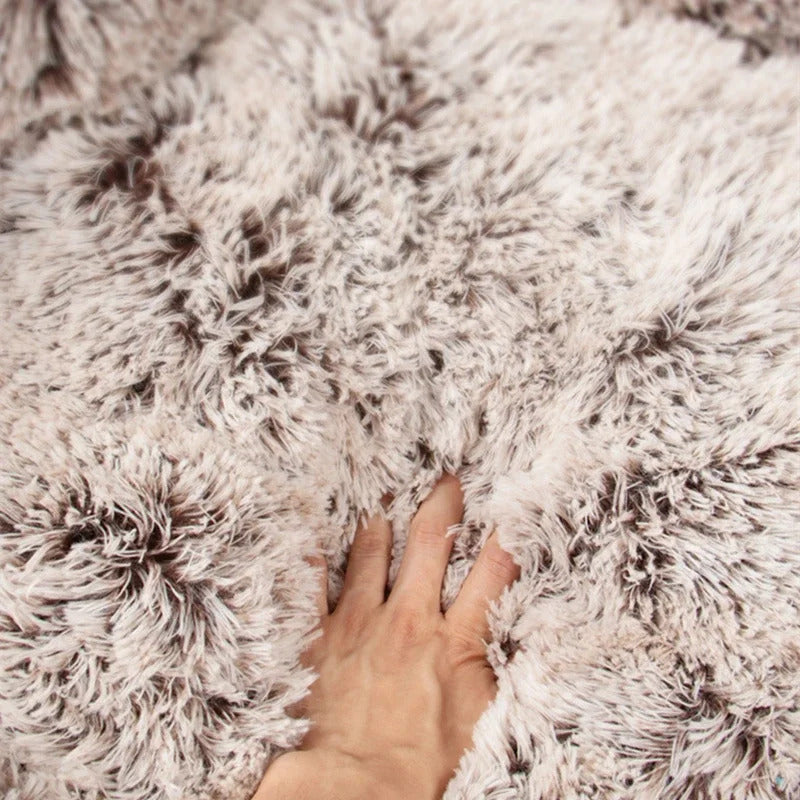 Large round coffee-colored dog bed mat with plush, bear paw shape, super soft, warm cushion for deep, calming sleep.