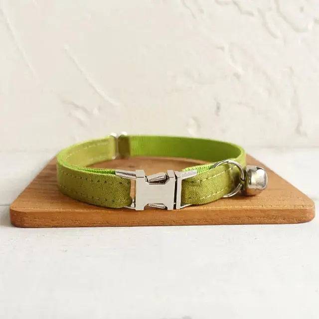 Green personalized dog collar with bell and engraved ID tag, suitable for small dogs, puppies, and cats from TrendyPet's Zone.