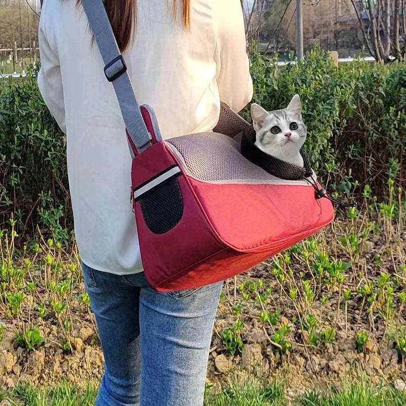 Red TrendyPet's Zone portable pet crossbody carrier with breathable mesh for dogs and cats, designed for comfortable one-shoulder use.