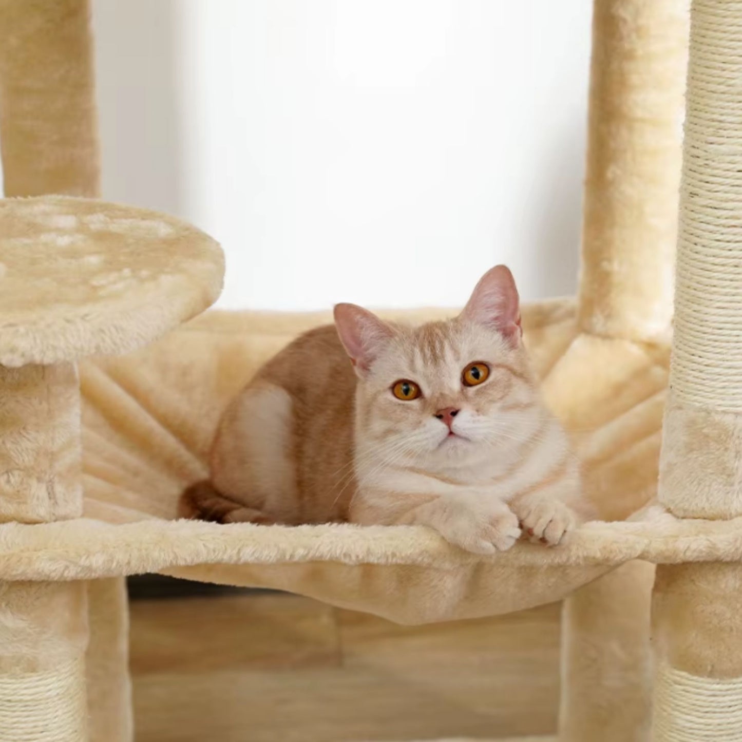 TrendyPet's Zone beige multilevel cat tree with sisal scratching posts, plush play house, spacious hammock, and large condos.