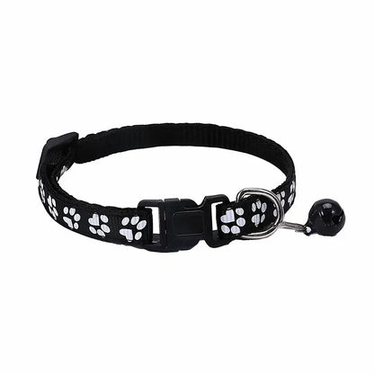 Black adjustable nylon cat collar with bell from TrendyPet's Zone, displayed with a pink collar on a cat, available in 19 colors.