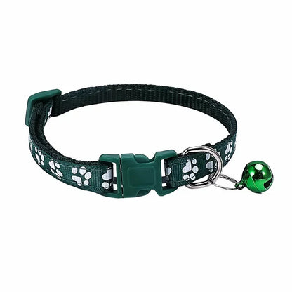 Dark green adjustable nylon cat collar with bell, shown with a pink collar, part of TrendyPet's Zone pet collar collection for cats and small dogs.