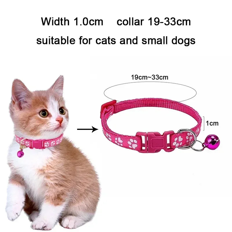 Red adjustable nylon cat collar with bell and pink paw print, worn by a cat, available in multiple colors from TrendyPet's Zone.
