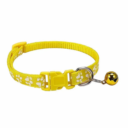 Dark yellow adjustable nylon cat collar with bell and paw print design, featuring multiple color options for cats and small dogs.