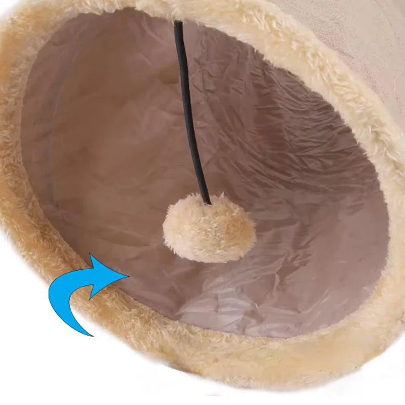 Pink plush cat tunnel toy made of soft suede, foldable for easy storage, designed for interactive play and fun for cats.
