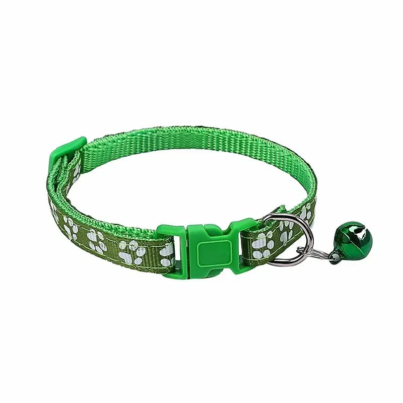 Light green adjustable nylon cat collar with bell from TrendyPet's Zone, shown on a cat alongside other colorful collars.