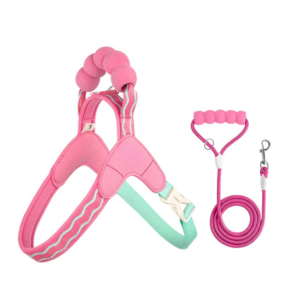 Pink escape-proof dog harness set with reflective stitching for all dog sizes, featuring adjustable straps and a matching leash.