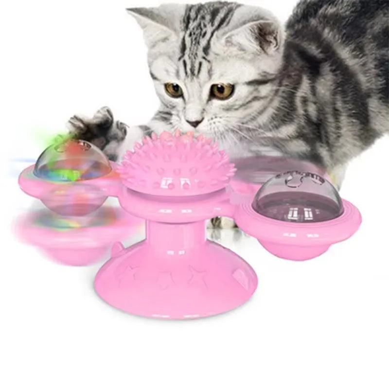Pink rotating windmill cat toy with LED lights on a suction cup base, designed for interactive play by TrendyPet's Zone.