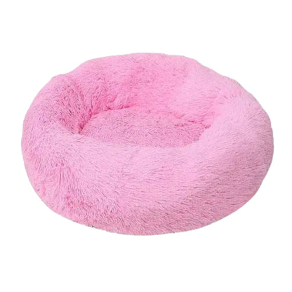 Pink round plush pet bed with thick padding and zipper, ideal for dogs and cats, from TrendyPet's Zone, super soft and calming.