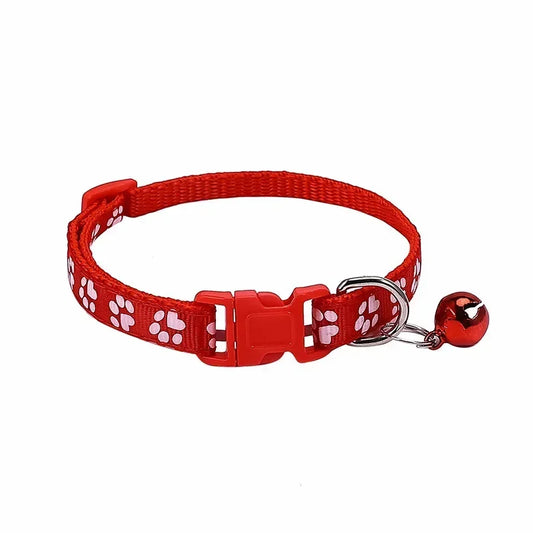 Red adjustable nylon cat collar with bell and soft paw print design, suitable for cats and small dogs, in 19 colors.