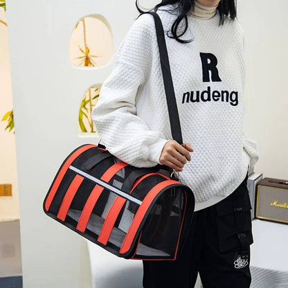 Red TrendyPet's Zone pet carrier bag with large capacity, breathable design, and shoulder strap for outdoor use in all seasons.