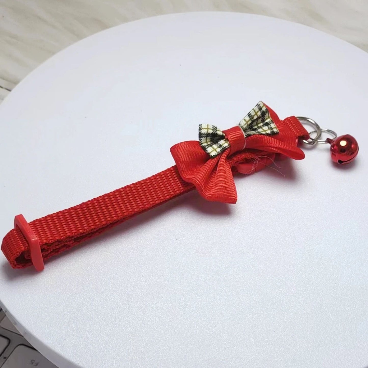 Red adjustable cat collar with bell and bow, stylish and comfortable, from TrendyPet's Zone.