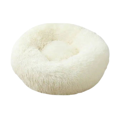 White round plush pet bed with zipper, thick cushioning, and soft fabric, ideal for calming dogs and cats from TrendyPet's Zone.