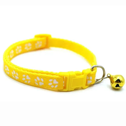 Yellow adjustable nylon cat collar with bell from TrendyPet's Zone, shown with a pink collar on a cat, available in 19 colors.