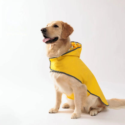 Yellow waterproof dog raincoat with quick-adjust dual-sided design by TrendyPet's Zone, suitable for all weather conditions.